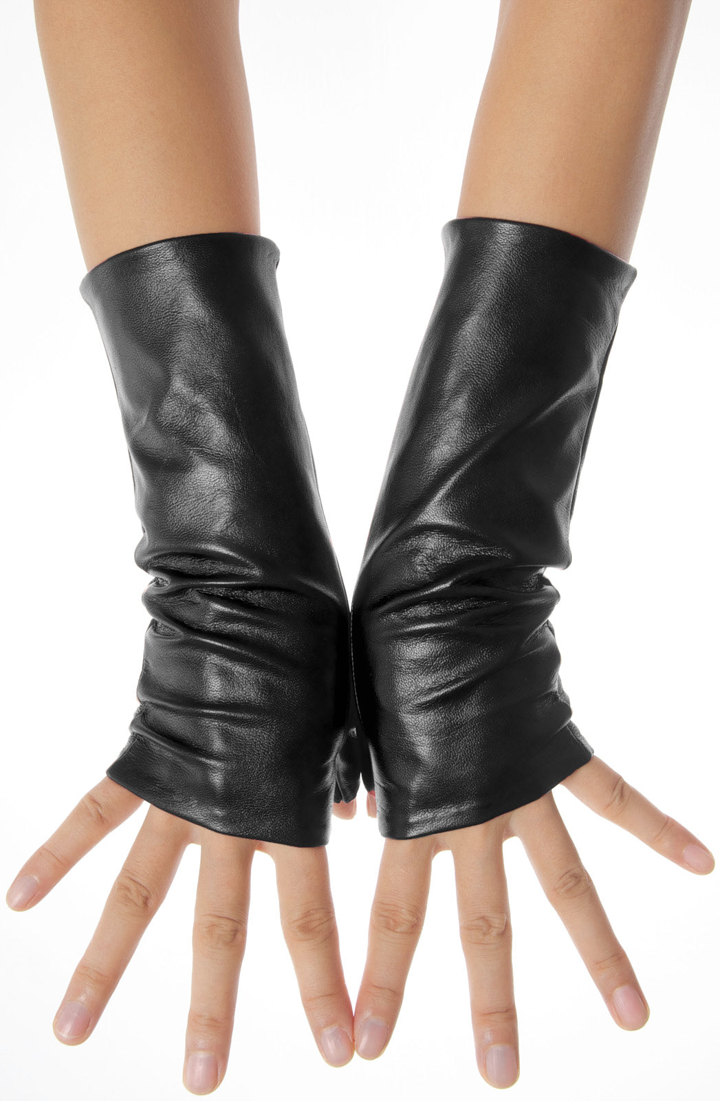 A pair of black fingerless leather gloves worn on a person's hands with arms stretched out
